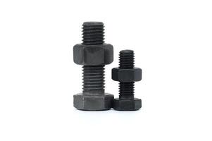 Closeup of assorted metal bolts and nuts isolated on a white background photo