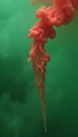 Green fog unfolds in slowmotion showcasing realistic atmospheric green smoke and a red fume rising gradually photo
