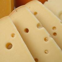 Showcasing various realistic cheese textures Swiss with its characteristic holes Blue with visible crumbling and the smooth surface of Gruyre photo