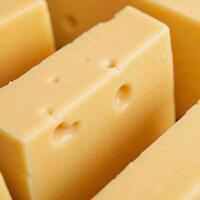 Isolated image displaying the textured and flavorsome appearance of melting cheese on cheese blocks liquid cheese splash photo