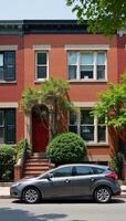 Row of homes featuring a parked vehicle on the street photo