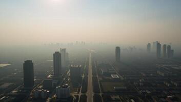 A panoramic aerial view captures the effects of toxic dust on urban landscapes symbolizing climate change air pollution and harm to the respiratory system photo