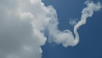 A digital art illustration featuring a cloudlike smoke element with a distinctively wavy or zigzag tail pattern photo