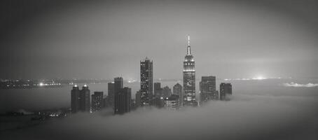 Monochrome cityscape mystical towering skyscrapers rise above the fog creating an enigmatic ambiance photo