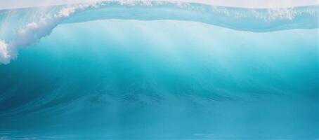 An aquaticthemed abstract design featuring a wavy textured ocean wave in shades of blue aqua and teal as a background suitable for use as a graphic resource or banner photo