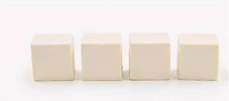 Whitebackground photograph featuring isolated tofu cubes photo