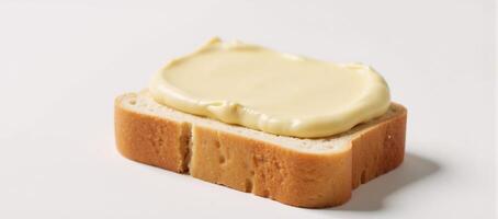 Butter spread on toast isolated on a pristine white background photo