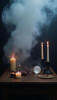 Foggy dark setting with smoke and mist on wooden table against an abstract and defocused Halloween backdrop photo
