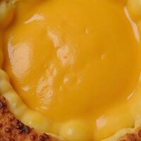 Closeup wallpaper featuring tasty melted cheese sauce textured image top view photo