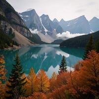Landscape featuring a tranquil lake nestled between majestic mountains and a serene forest with enveloping fog photo