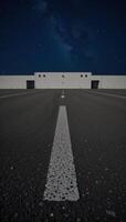 Abandoned nighttime scene featuring an empty asphalt surface beneath twinkling stars photo