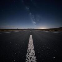 Abandoned nighttime scene featuring an empty asphalt surface beneath twinkling stars photo