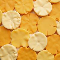 A diverse array of cheese types arranged to create a unified eyecatching design photo