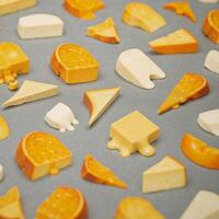 Graphic art showcases a texturerich repetition of multiple cheese slice patterns photo