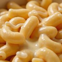 Detailed closeup of macaroni and cheese texture on macro scale photo