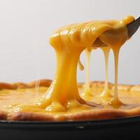 Melted cheese burst with flavorful splashes photo
