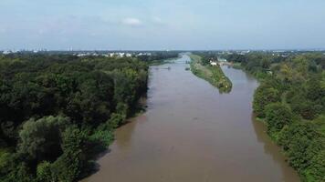 Flowing stream of dirty water in the river, river filled with dirty water after flood. Oder River, Poland video
