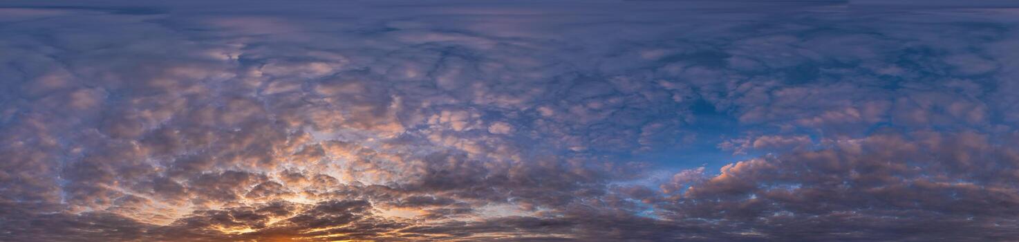 Golden sunset sky panorama Seamless spherical equirectangular 360-degree view with beautiful Stratocumulus clouds, setting sun - for use in 3D graphics as a sky dome or post-processing of drone images photo