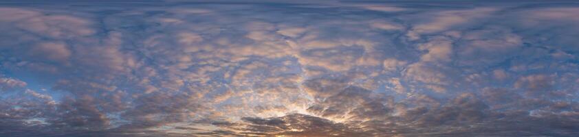 Golden sunset sky panorama Seamless spherical equirectangular 360-degree view with beautiful Stratocumulus clouds, setting sun - for use in 3D graphics as a sky dome or post-processing of drone images photo