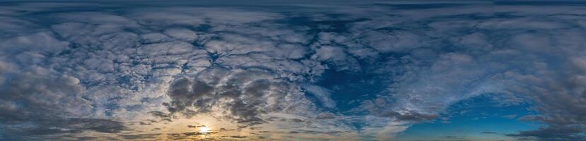 Blue evening sky Seamless spherical equirectangular panorama 360-degree view with beautiful Stratocumulus clouds, setting sun - for use in 3D graphics as a sky dome or post-processing of drone images photo