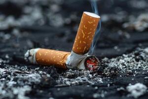 Lit cigarette is smoldering, creating a plume of smoke photo