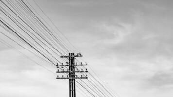 A black and white photo of a telephone pole