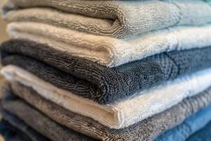 Stack of folded soft cotton towels creating relaxing background photo