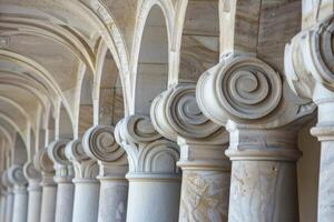 Row of sandstone columns supporting arched ceiling in cloister photo