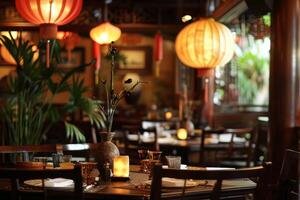 Elegant table setting for dinner in chinese restaurant with lanterns photo