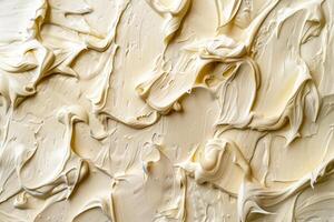 Highresolution image featuring a smooth and creamy beige texture with dynamic swirls photo