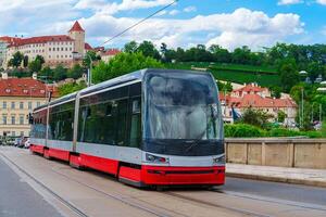 This sleek, modern red tram is essential to the citys public transportation. Its favored by locals and tourists for a comfortable, convenient way to explore the sights and attractions. photo