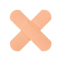 Two plasters in the shape of a cross isolated on a white background. Stock photo. photo