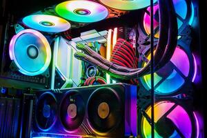 The image displays a custom-built personal computer featuring vibrant RGB lighting and an efficient liquid cooling system. High-end components are organized, showcasing the builders design attention. photo