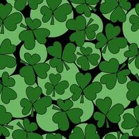 Seamless pattern of clover leaves and light green circles of various sizes on a black background, a symbol of good luck and St. Patrick's day vector