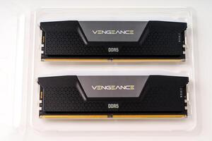 December 2023, Tallinn, Estonia. Corsair. A pair of black and gray computer memory modules showcased on a white background. Each module features the word VENGEANCE and a DDR5 label, emphasizing their high-performance design. photo