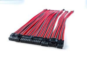 A close-up image of a black and red computer cable on a white background. This durable cable is ideal for any computer system, ensuring reliable performance and long-lasting use. photo