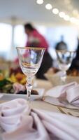 Wine glass and elegant table setting for wedding reception in slow motion video