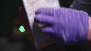 Applying Ski Wax To Ski Base with iron. Ski base tuning and paraffin bars. skiing service repair. repairman in workshop ski service. Man Waxing In Workshop video