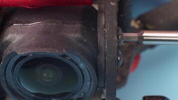 Close-up setup and installation of the FPV course camera on a self-assembled drone in a carbon frame. Close-up macro shot video