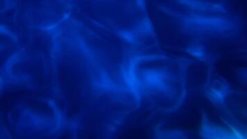 Dark blue fluid shadow from aquarium motion background with curvy wave flowing. video