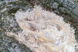 zenithal aerial drone view of an active granite quarry photo