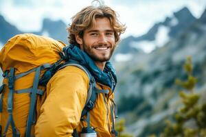 A man with a backpack smiling in the mountains photo