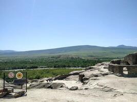 Breathtaking view from ancient ruins overlooking lush valleys and distant mountains during a bright sunny day in Mongolia photo