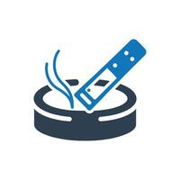 Cigarette in an ash tray with smoke icon vector