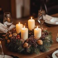 Elegant Christmas table centerpiece with glowing candles, pine cones, poinsettias, and festive ornaments, creating a cozy holiday atmosphere photo