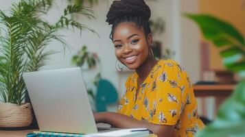 Happy young woman working on her laptop in a bright home office with plants, embracing a productive and cozy atmosphere photo