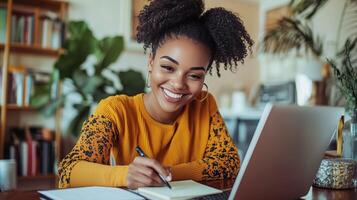 Smiling young woman studying at home, writing notes while using a laptop in a cozy, well-decorated space photo