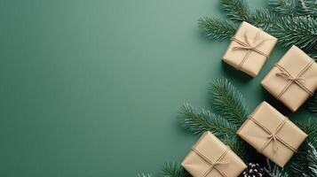 Minimalist Merry Christmas and Happy New Year greeting card or web banner with gift boxes, copy space, natural pine branches on a green background representing Christmas celebrations. Minimal art photo