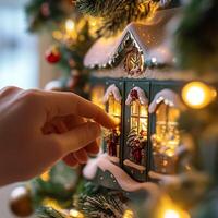 Hand opening an advent calendar door on a Christmas tree with festive lights and holiday decoration photo