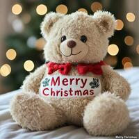 Fluffy teddy bear with a red bow and Merry Christmas message sitting in front of blurred holiday lights photo